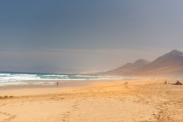 People in the Virgin beaches on the island of Fuerteventura. Cofete beach on the island of Fuerteventura, Spain.