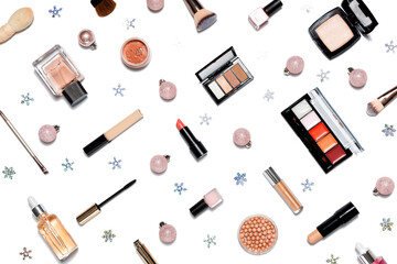 Decorative cosmetics and makeup tools on white background with Christmas fir tree ornaments. Online shopping concept. Frame composition with copy space. Flat lay or top view