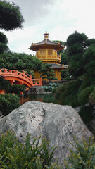 Golden Pagoda with red bridge in Nan Lian gardens, Kowloon City, Hong Kong