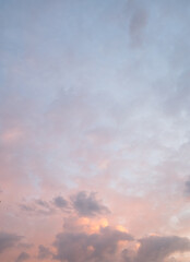 sky in the evening with light red and clouds in different shades of grey