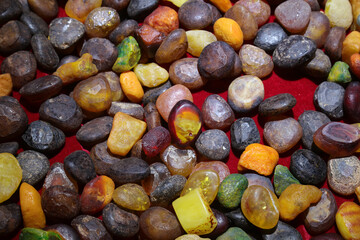 Beeswax stones are stacked together in a handicraft workshop, China
