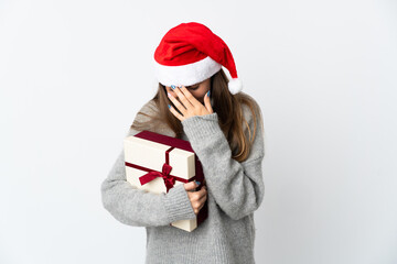 Lithianian woman with christmas hat holding presents isolated on white background laughing