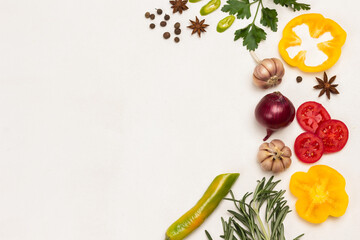 Spices on White background. Garlic and rosemary, peppers, tomatoes.