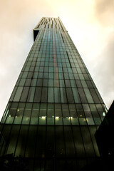 Worms eye view of the Hilton Hotel Manchester on an overcast day