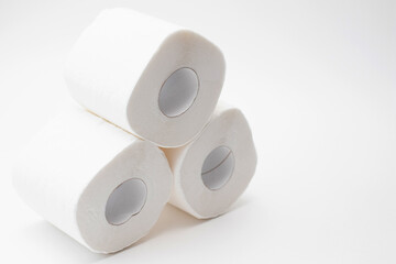 Stak rolls of toilet paper on white. Personal hygiene products