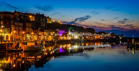 Whitby Harbour at night with sunset sky taken at Whitby, Yorkshire, UK on 21 May 2018
