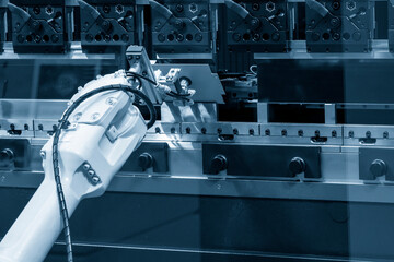 The robotic arm operation at hydraulic bending machine. The hi technology sheet metal forming...