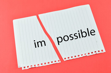 Torn papers with IMPOSSIBLE word. Motivational concept. 