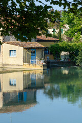 Fototapeta na wymiar Typical houses on the medieval village on the Mincio river in Borghetto, Verona (Italy). One of the most beautiful villages in Italy.