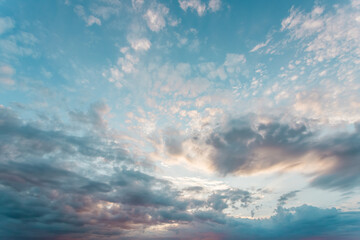Blue sky with a pastel colored. Soft texture of fluffy clouds.