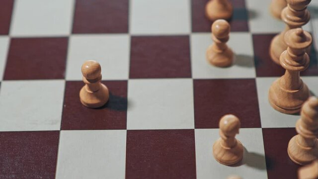 White chess piece being moved by itself.