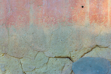 green old texture of plaster on the wall of a street house