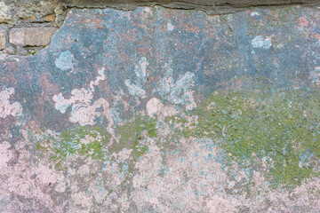 green old texture of plaster on the wall of a street house