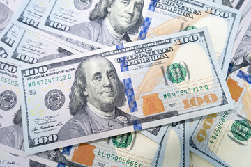 hundred-dollar bills are thrown on the table