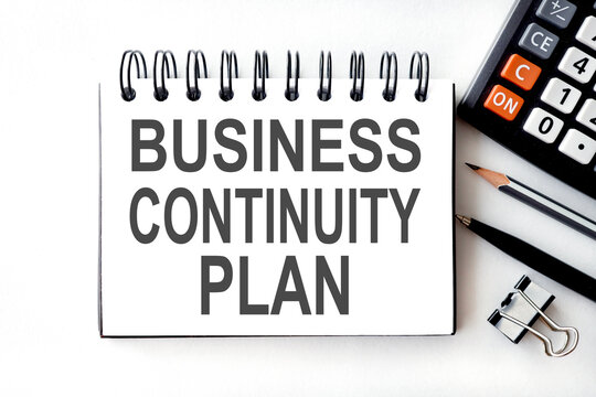 BUSINESS CONTINUITY PLAN, text on white paper on a light BACKGROUND