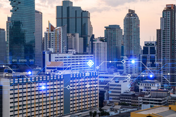 Glowing hologram of technological process, aerial panoramic cityscape of Bangkok at sunset. The largest innovative hub of tech services in Asia. Multi exposure.