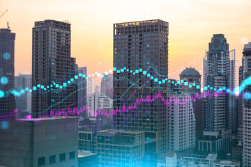 Obraz na płótnie Canvas Glowing FOREX graph hologram, aerial panoramic cityscape of Bangkok at sunset. Stock and bond trading in Asia. The concept of fund management. Double exposure.