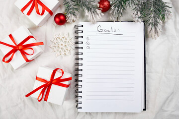 Top view of blank notebook for goals resolutions and christmas decoration