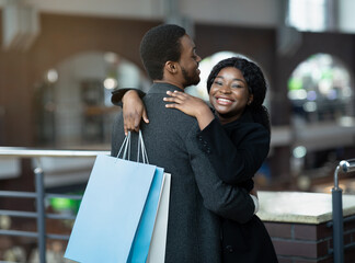 Free time and romantic date of african american couple at mall