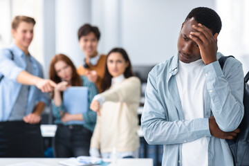 People mocking and making fun of sad black guy