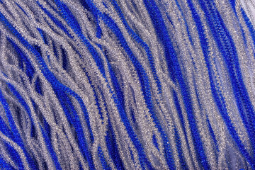 shiny Christmas swirling ribbons of blue and silver rain. view from above