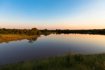 Fototapeta na wymiar Magical sundown on the shore of a Lake in South Africa, Kruger nationalpark