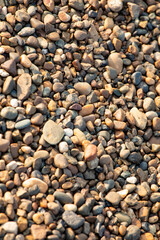 background of stone pebbles on the seashore