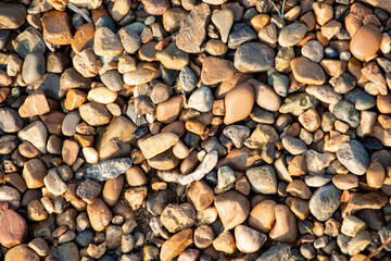 background of stone pebbles on the seashore