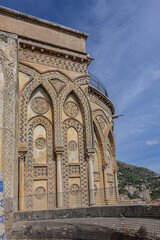 Fototapeta na wymiar Fragment of Roman Catholic Cathedral of Monreale (or Duomo di Monreale, 1267) near Palermo; one of greatest extant examples of Norman architecture. Monreale, Sicily, Italy, Europe.