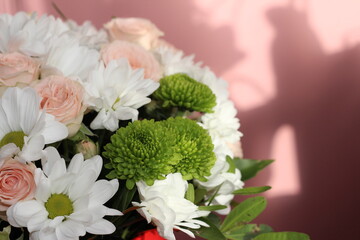 A bouquet of white flowers on a delicate background.