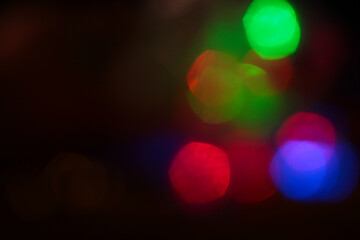 Evening bokeh. Background with highlights in blue, red, green, and yellow.