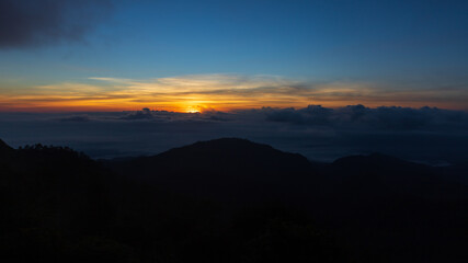 Landscape mountain silhouette at sunrise