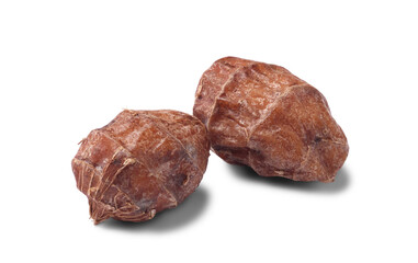 Close up of raw tiger nuts (chufa nuts) isolated on white background