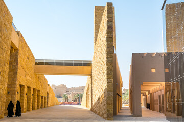 Arabic women walking in the Diraiyah, also as Dereyeh and Dariyya, a town in Riyadh, Saudi Arabia,...