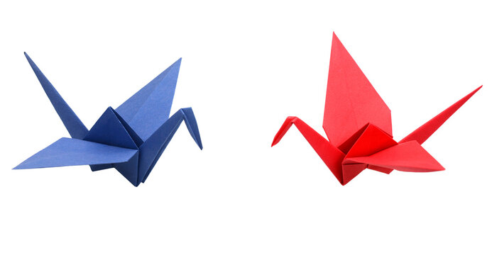 red and blue origami paper cranes on white