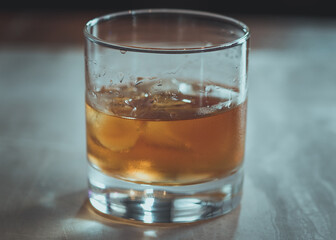 A glass of rum on the rocks.