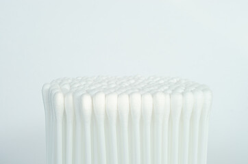 Close-up picture isolated a bunch of soft cotton buds or cotton swab ear buds or for absorbent makeup remover from eyes white background.