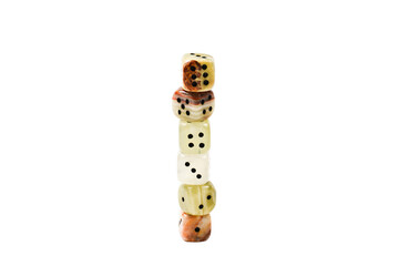 Dices made of natural stone on a white background. Copy space. Gaming.