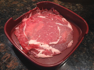 Raw beef sliced pieces on  dish