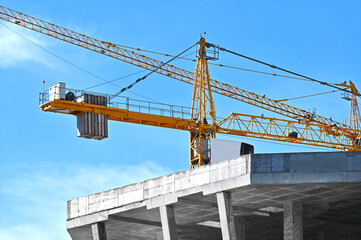 Crane and highrise construction site