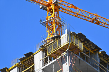 Crane and highrise construction site