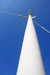 wind turbine against a blue sky	