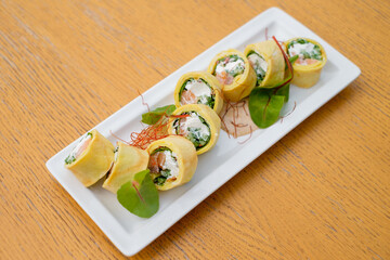 Rolls with cream cheese and vegetables top view.