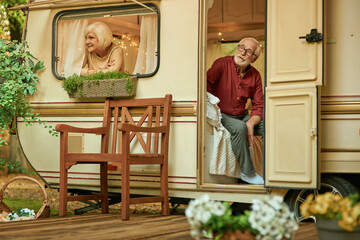 Happy elderly couple relaxing together in their traile