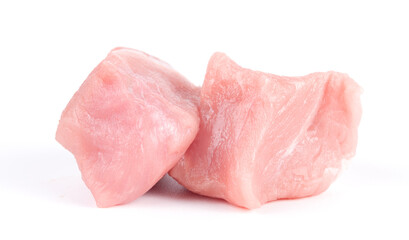 Pile of pork uncookes chopped cubes close up isolated on white background
