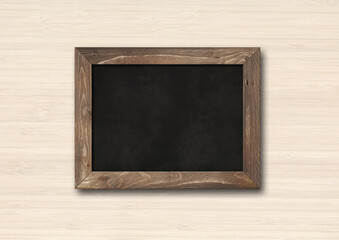 Old rustic black board isolated on a wooden background