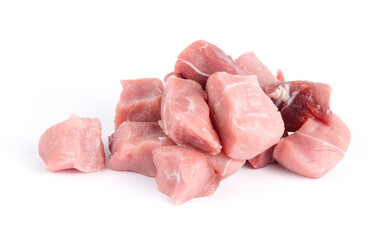 Pile of pork uncookes chopped cubes close up isolated on white background