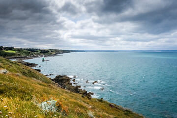 Fototapeta na wymiar Lighthouse and coast landscape in Brittany, France