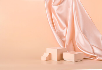 Modern abstract podium on pastel monochrome background with shiny draped fabric