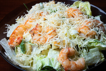 Caesar salad with prawns and Parmesan cheese